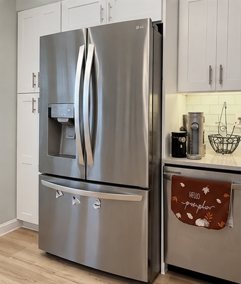 White Shaker refrigerator wall and Gray Galaxy quartz countertop in a Belton, MO kitchen