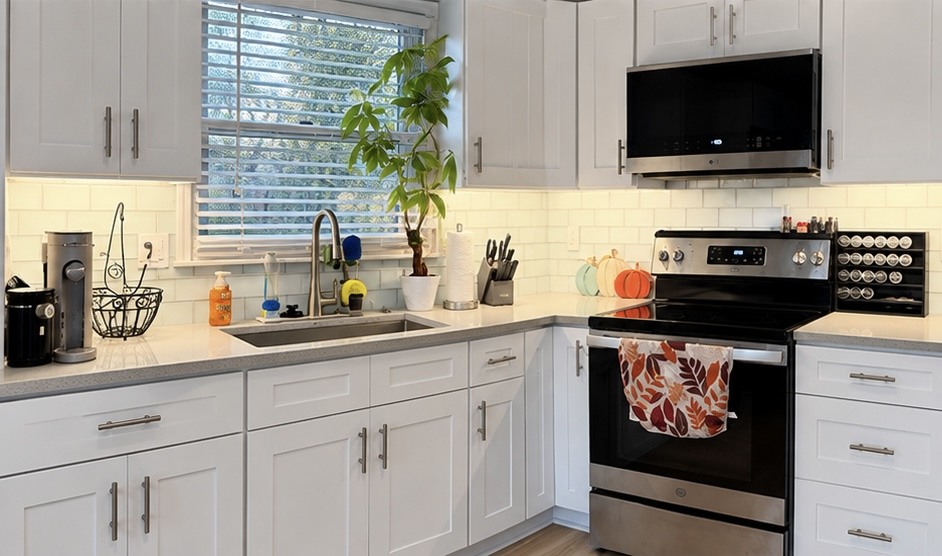 Gray Galaxy quartz countertop and stainless single bowl undermount sink with White Shaker cabinets in Belton, MO