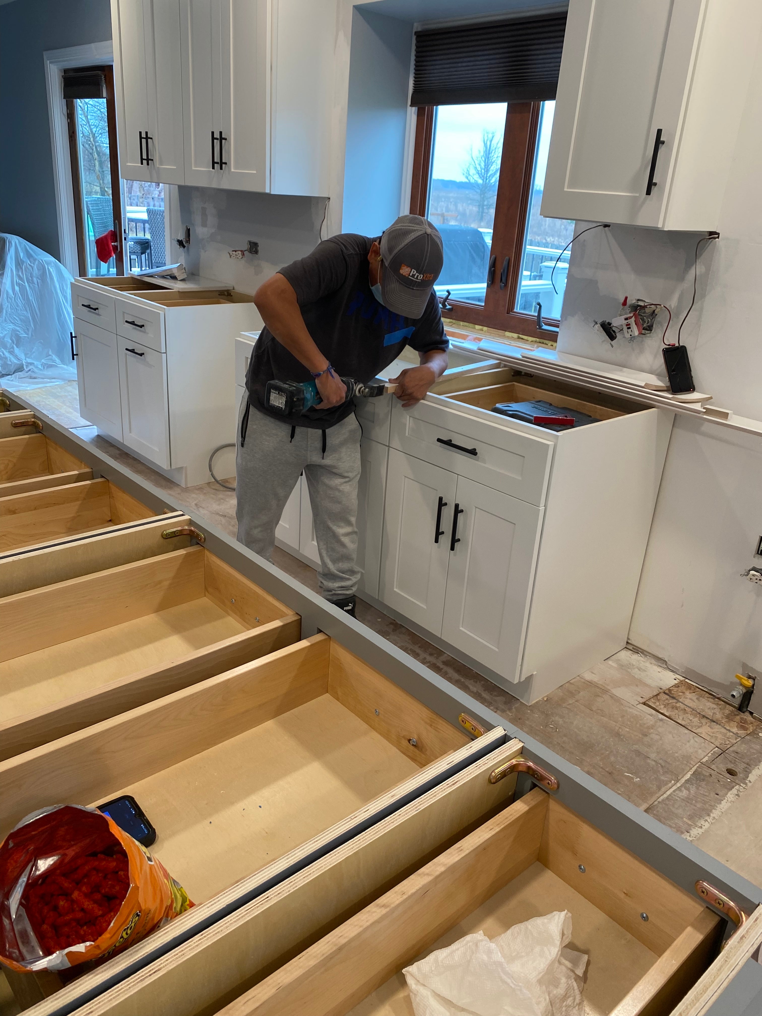 Professional kitchen cabinet installation in progress in a Kansas City home
