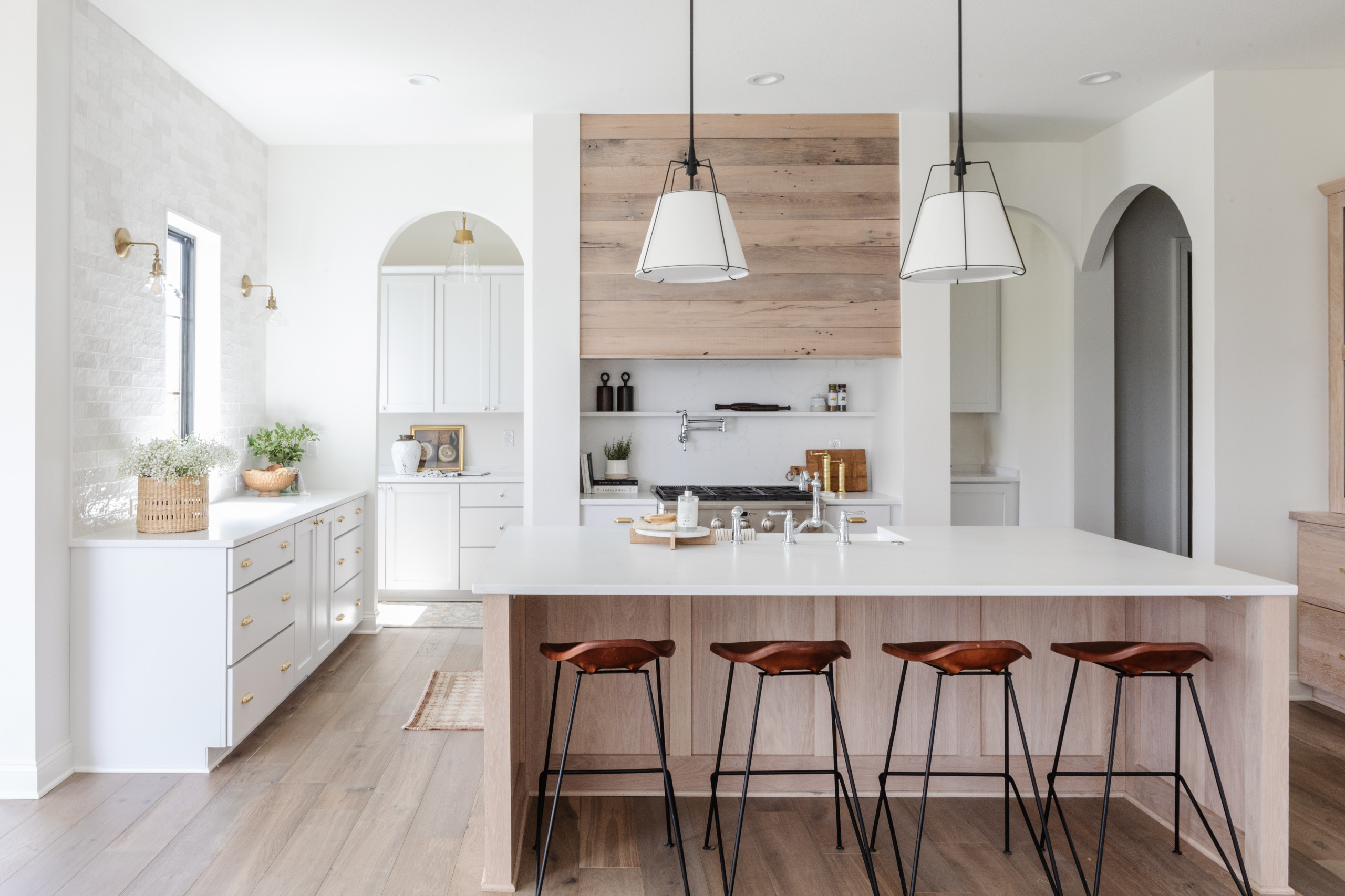 Elegant white kitchen with marble-look quartz countertops, shown as Prairie Village design inspiration