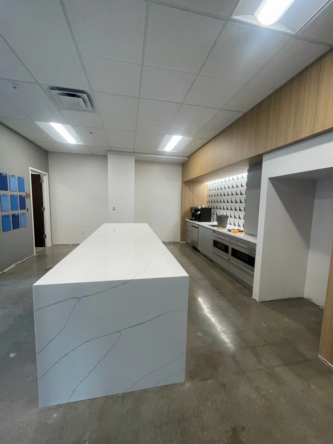 White quartz kitchen island installed by KC Cabinetry & Stone in Kansas City